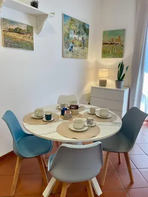a dining room with a table and four chairs at CasaPA-Appartamento a due passi dal Teatro Massimo in Palermo