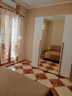 a bedroom with a mirror and a room with a bed at Franci Zisa House in Palermo