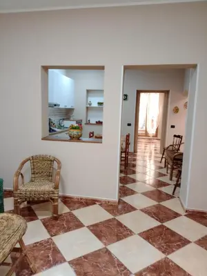a living room with a checkered floor at Franci Zisa House in Palermo