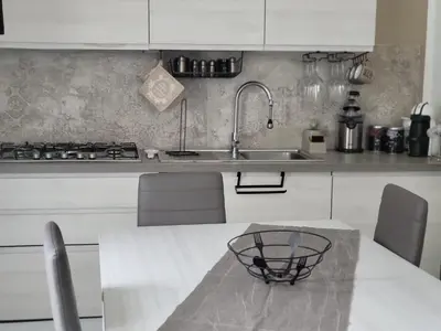 a kitchen with a sink and a counter top at La loggia Apartment in Palermo