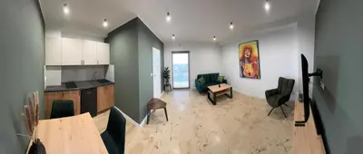 a kitchen and living room with a table and chairs at Asia Sicilian Home in Carini