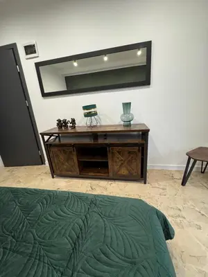 a room with a dresser with a mirror on the wall at Asia Sicilian Home in Carini