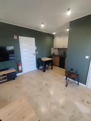 an empty living room with a table and a door at Asia Sicilian Home in Carini