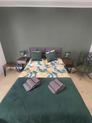 a bedroom with a bed with two pillows on it at Asia Sicilian Home in Carini