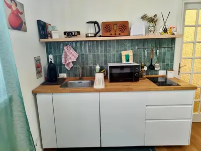 a bathroom with a white sink and a toilet at Maskan Palermo centro in Palermo