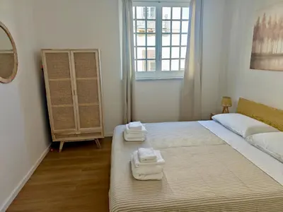 a bedroom with a bed with two towels on it at Maskan Palermo centro in Palermo
