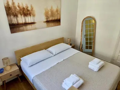 a bedroom with a bed with two towels on it at Maskan Palermo centro in Palermo
