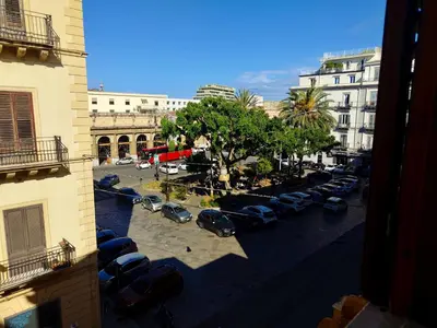 a bunch of cars parked on a city street at Maskan Palermo centro in Palermo