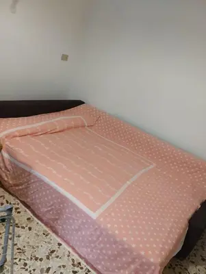 a pink mattress sitting on a floor in a room at Villetta Casaurro in Bagheria
