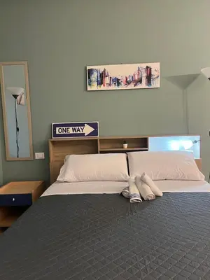 a bedroom with a one way sign above a bed at Al Tribunale Guest House in Palermo