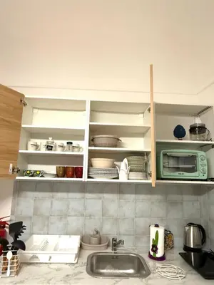 a kitchen counter with a sink and a microwave at Shama APARTMENTS in Palermo