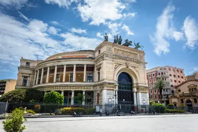 a large building in a city with a sky at Gravina 75 Rooms in Palermo