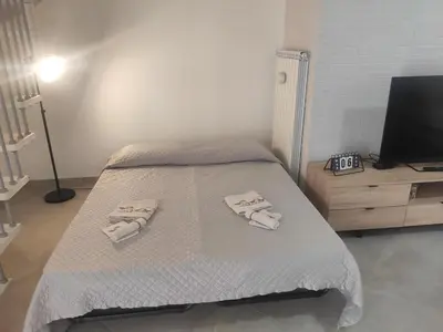 a bedroom with a bed with towels on it at Central modern vacation home in Lascari - Casa Vacanze Luna in Lascari