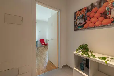 a room with a hallway with a mirror and a table at Vetro Apartments by Wonderful Italy in Palermo