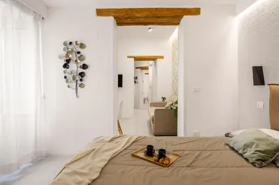 a bedroom with a bed with a tray of fruit on it at Vittorio Maison - centro storico in Palermo