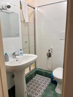 a bathroom with a sink and a toilet at La Loggia del Capo in Palermo