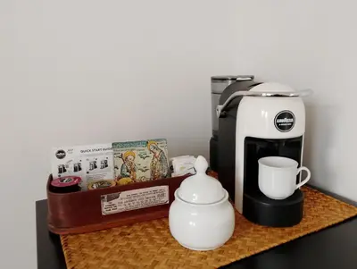 a coffee maker and a coffee pot on a counter at Rooftop Magione in Palermo