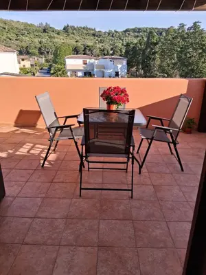 a beach with a bottle on the sand and the ocean at Raggio di Sole in Campofelice di Roccella