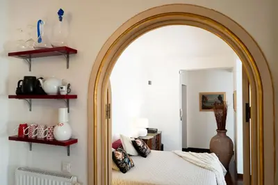 a bedroom with a bed and a large mirror at Habitat in Palermo