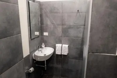 a bathroom with a sink and a shower at Habitat in Palermo