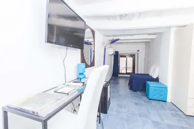 a hospital room with a table and a tv at B&B del Massimo in Palermo