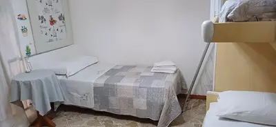 a small room with a bed and a table at Casa del Vecchio Borgo in Caccamo