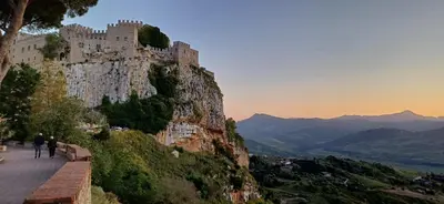 a castle on the side of a mountain at Casa del Vecchio Borgo in Caccamo