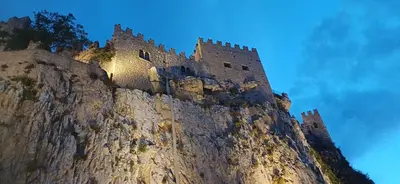 a castle on the side of a mountain at Casa del Vecchio Borgo in Caccamo