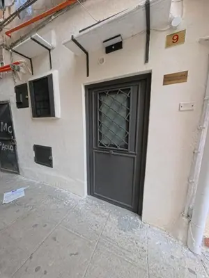 a door on the side of a building at A Little Modern House in Palermo