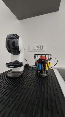 a coffee machine sitting on top of a floor at L'ulivo-casa tua a Palermo, a due passi dal centro in Palermo