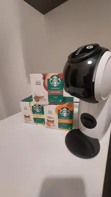 a coffee machine sitting on top of a counter with some food at L'ulivo-casa tua a Palermo, a due passi dal centro in Palermo