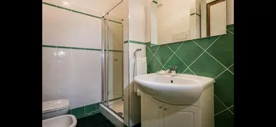 a bathroom with a sink and a shower and a toilet at Borgo la Madrice in Castellammare del Golfo