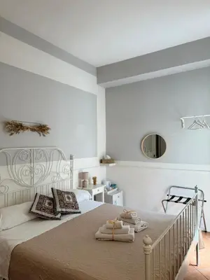 a bedroom with a bed with towels on it at Dimora San Domenico in Palermo