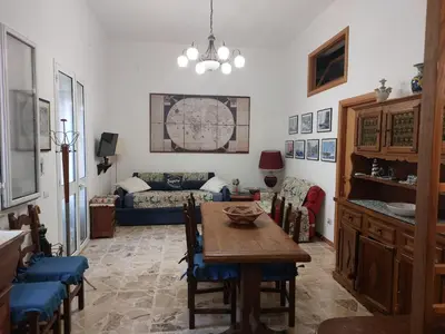 a living room with a table and a couch at Darling in Capaci