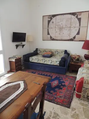 a living room with a couch and a table at Darling in Capaci