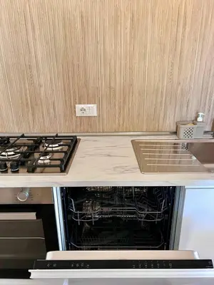 a kitchen with an oven and a counter top at Villa Gargaf in Altavilla Milicia