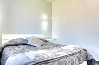 a bedroom with a bed with towels on it at Villa Stella con piscina privata 500 mt dal mare By Sicily Home Solutions in Trappeto