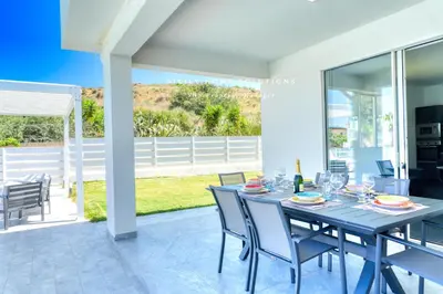 a dining room with a table and chairs at Villa Stella con piscina privata 500 mt dal mare By Sicily Home Solutions in Trappeto
