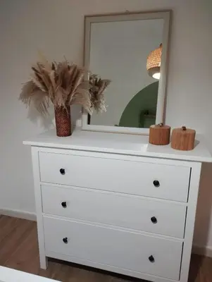 a white dresser with a mirror on top of it at Mammì in Balestrate