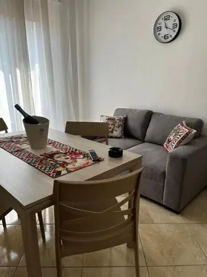 a living room with a table and a couch at Dimora del Moro in Castellammare del Golfo