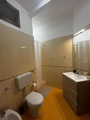 a bathroom with a toilet and a sink and a shower at Dimora del Moro in Castellammare del Golfo