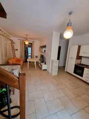 a kitchen and living room with a tile floor at Casa Vacanze Soleado house Trabia PA, Sicily in Mandra Capreria