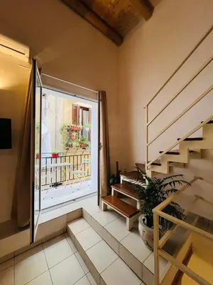 a room with a staircase and a window at Mia Domus in Palermo