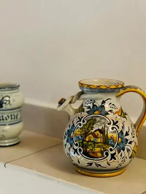 a blue and white vase sitting on a counter at Mia Domus in Palermo