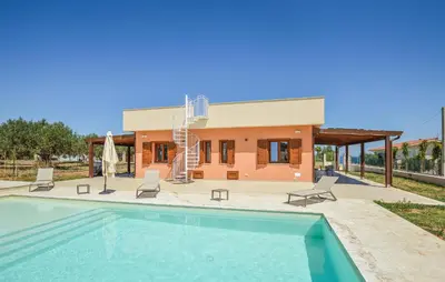 a villa with a swimming pool and a house at Nice Home In Balestrate in Balestrate