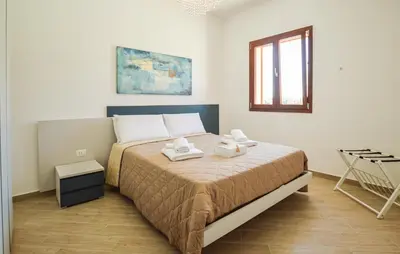 a bedroom with a bed with two towels on it at Nice Home In Balestrate in Balestrate