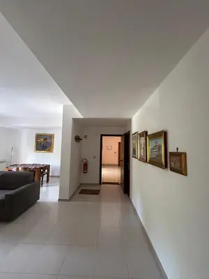 a living room with a couch and a table at La casa dei Nonni in Santa Flavia