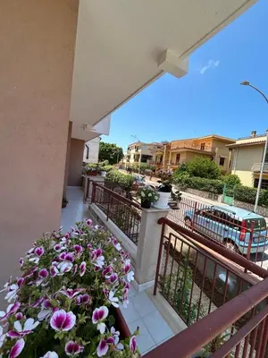 a balcony with a bunch of flowers on it at La casa dei Nonni in Santa Flavia