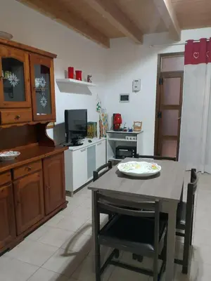 a kitchen with a table with a plate on it at La Casetta Di Liù in Villagrazia