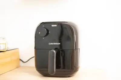 a black appliance sitting on top of a counter at Re Tancredi Apartment in Palermo
